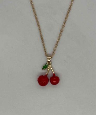 Fashion necklace featuring a red enamel double-cherry pendant on a gold-toned alloy chain